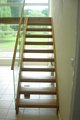 Open riser with glass balustrade stair